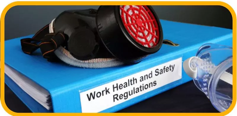  blue binder labeled "Work Health and Safety Regulations" with a safety mask and goggles.